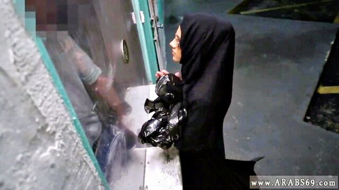 Arab woman in black hijab and abaya meets man in parking garage, desperate cash encounter