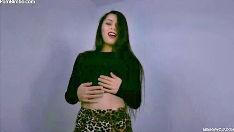 Skinny brunette MILF squeezes her medium tits teasingly in black crop top and leopard shorts