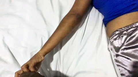 South Asian babe in blue crop top and shiny satin pants grabbing thick dark cock on bed