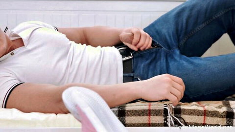 Alien Fox lies on bed with hand in open jeans, teasing tight ass for anal