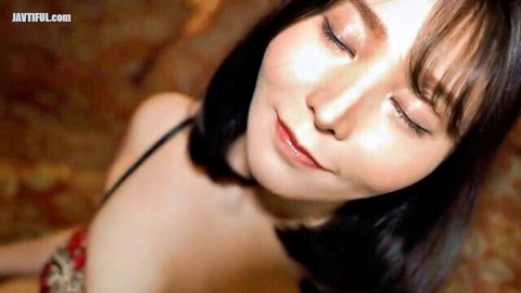 Japanese woman in ecstatic close-up, eyes closed in orgasm bliss from Wild Orgasm Hell