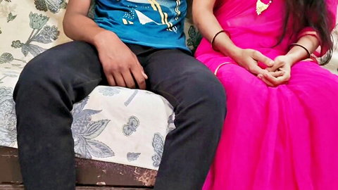 Indian Jija Sali in pink saree teasing with step-brother on couch