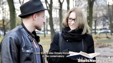 Nerdy couple chatting outdoors with books before group sex orgy