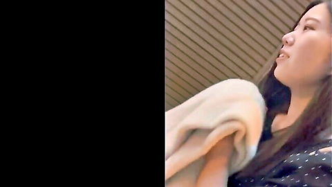 Asian woman with long hair in teasing side profile, ready for rough gangbang in FC2 amateur video