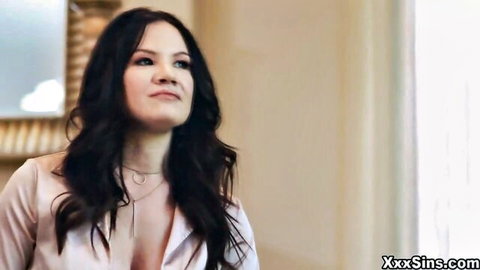 Alison Rey in low-cut top showing cleavage, seductive gaze