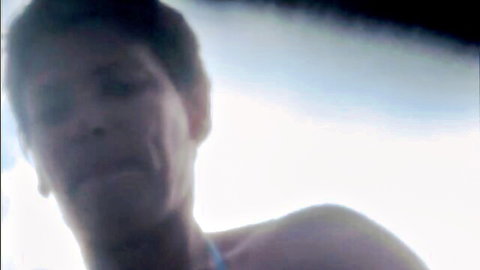 Closeup of short-haired white babe's ecstatic orgasm face moaning in pleasure