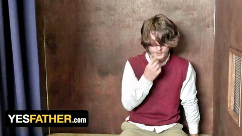 Young blonde Mormon boy in vest poses thoughtfully in altar boy seduction scene