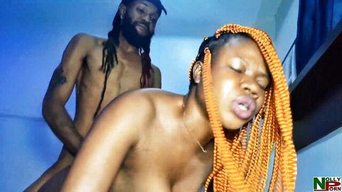 Ebony babe with orange braids fucked doggystyle by dreadlocked stud's huge black cock