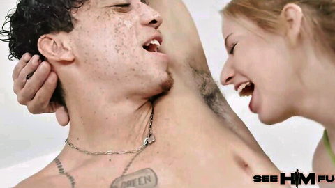 Tattooed freckled guy snarls gripping redhead babe with bangs head for rough intense face fuck