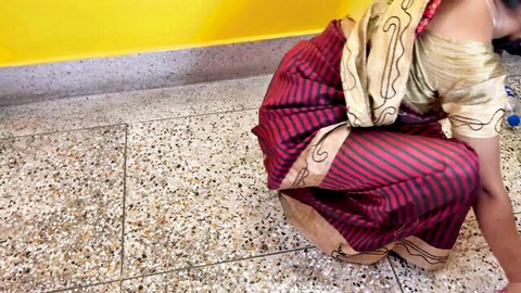 Desi woman in colorful saree bending over seductively