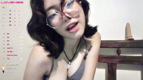 Amanda Vais in glasses and cleavage, webcam tease for 20th anniversary threesome