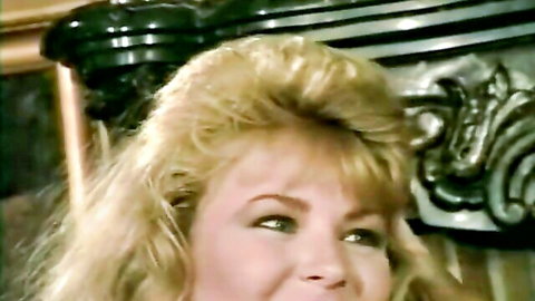 Vintage blonde Betina Cox smiling seductively in French lesbian scene