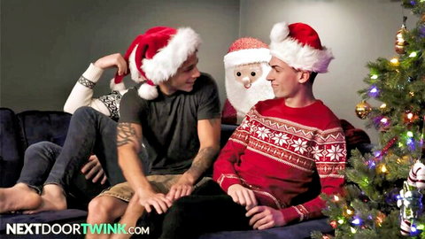 Kyle Wyncrest in festive gay holiday scene with Santa hats and close intimacy