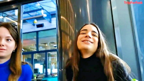 Two young skinny brunettes with long hair smiling teasingly in tight clothes before threesome fuck