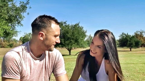 Colby Tucker and Paul Wagner flirt smiling outdoors in park
