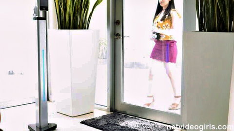 Lily Lou in pink miniskirt and heels at doorway audition