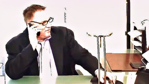 Handsome mature DILF in suit talking on phone at office desk