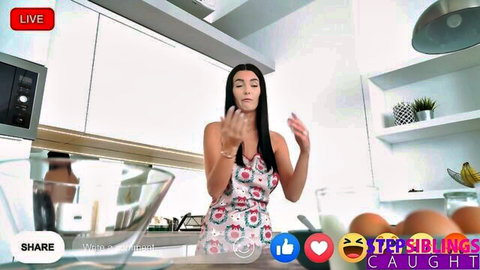 Simon Kitty in floral dress teases during live stream kitchen scene