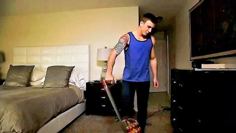Tom Faulk muscular hunk in blue tank top vacuuming bedroom