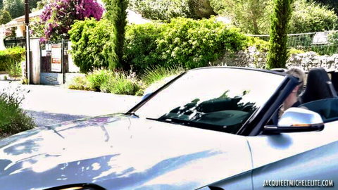 Blonde MILF Irina Kovalenko smiling in silver BMW convertible