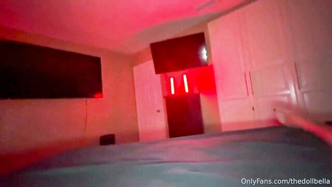 Red neon lit bedroom with TV and wardrobe from trans OnlyFans thedbella