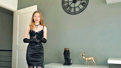 Sexy redhead Russian babe in black lace bralette gloves and mini skirt posing dominatrix style
