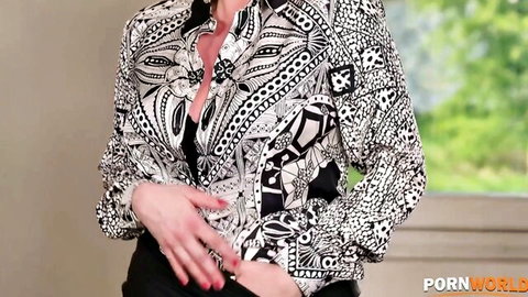Brittany Bardot in sexy patterned blouse with deep cleavage pose