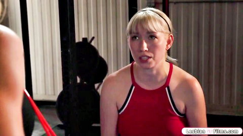 Blonde fit babe in tight red tank top with open mouth at gym