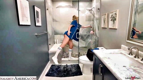 Blonde cheerleader teen in tiny skirt bends over reaching into steamy shower