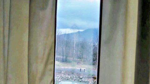 Diana M's scenic mountain view from car window before steamy shower adventure