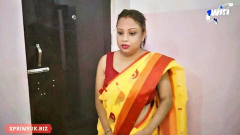 Desi Indian MILF in yellow sari teases in cuckold cougar video