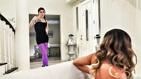 Two hot trans women in black dress and stockings posing seductively