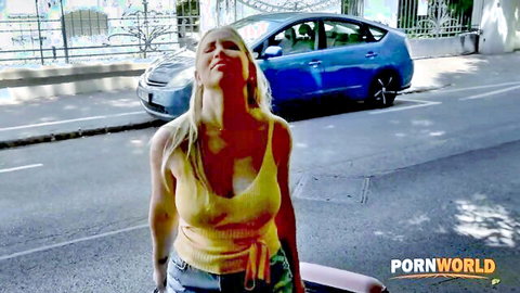 Blonde with medium tits in yellow tank top moaning ecstatically on street by blue car