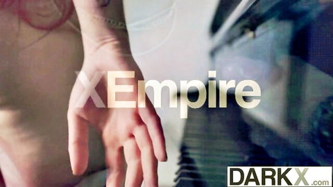 Pale tattooed woman's arm and hand in DarkX adult video promo