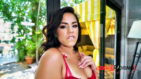 Young Monica in red lingerie teasing cleavage poolside