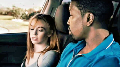 Redhead woman relaxes in car with black stud Isiah from group sex scene