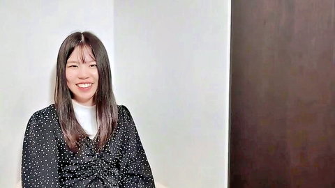 Cute smiling Asian college student in polka dot blouse teasing tight pussy