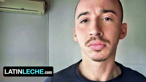 Bald Latino guy with mustache stares at camera in LatinLeche gay porn preview