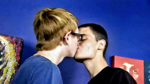 Two young men passionately kissing in close embrace