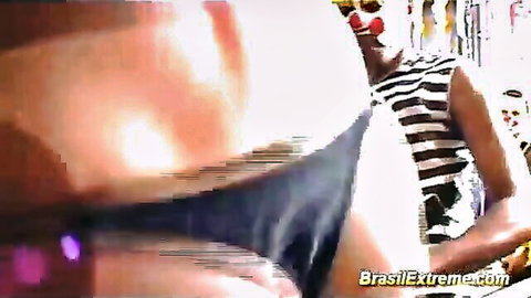 Brazilian woman in striped top exposing ass in wild orgy frenzy