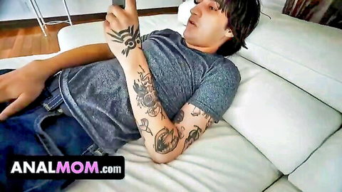 Tattooed Asian stepson lounging casually before massive cock lesson from stepmom