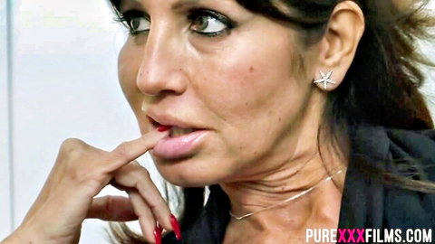 Seductive hot brunette teasing lips, mature beauty in black dress