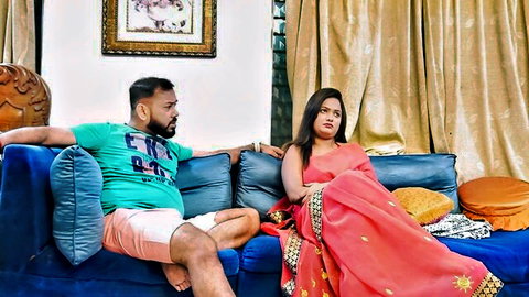 Desi Bhabhi in red saree teases chubby neighbor on sofa, craving rough deep sex