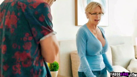 Busty blonde MILF in low-cut blue sweater shows huge tits to stepson groping her chest