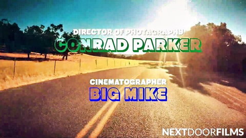 Next Door Films credits with Director of Photography Conrad Parker and Cinematographer Big Mike on scenic road background