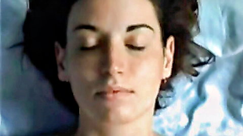 Close-up of cute girlfriend's serene face with eyes closed, caught on hidden cam