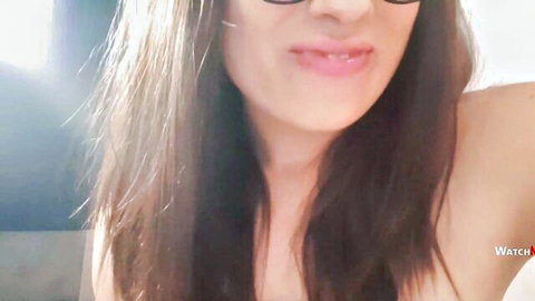 Close-up of sexy brunette in sunglasses smiling, talking dirty POV with vibrator