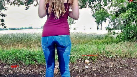 Blonde model freakart in wet jeans, outdoor ass view with tiny tits tease
