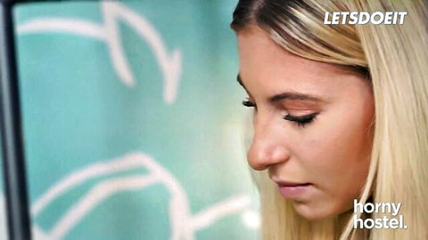 Lilly Bell blonde bombshell looking horny in hostel close-up