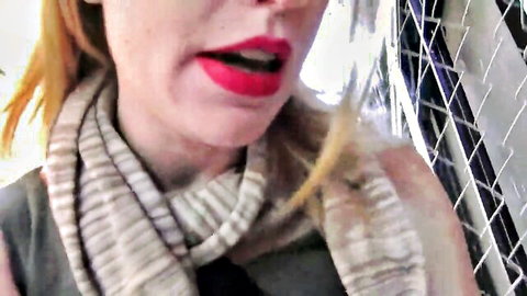 Close-up of seductive English blonde with red lips in lesbian teaser